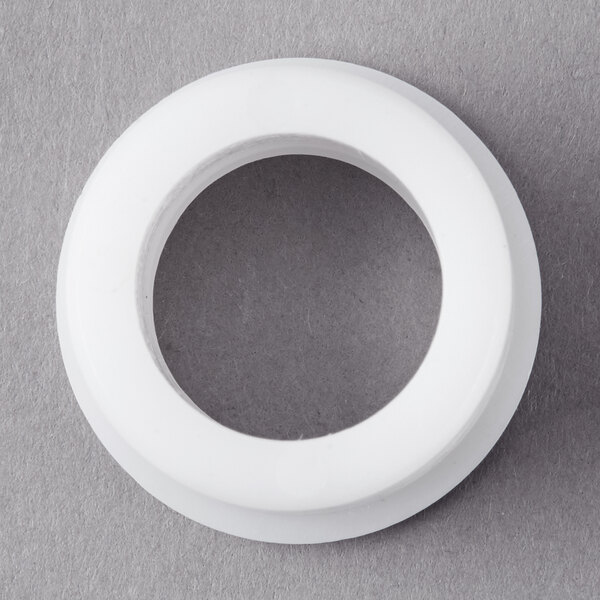 A white circular bearing with a hole in the center.
