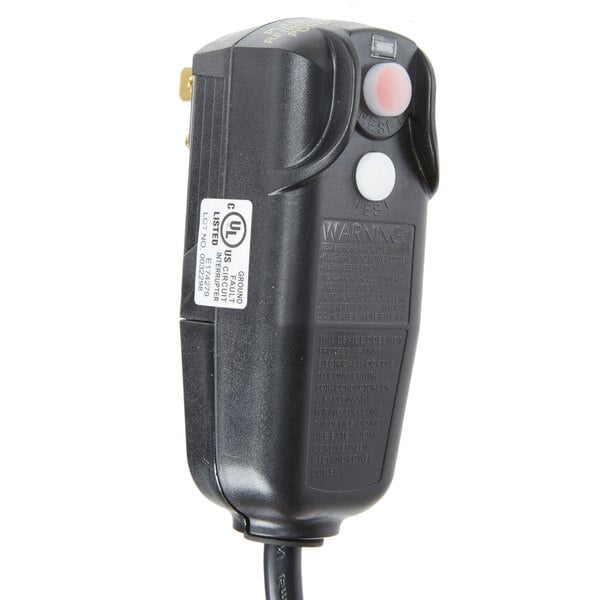 A black Noble Products power cord with red light on it plugged into a black device.