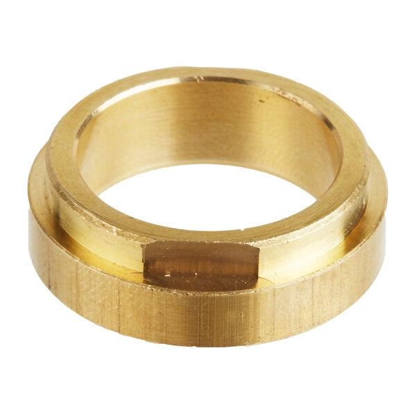A bronze gear bearing with a hole in it.