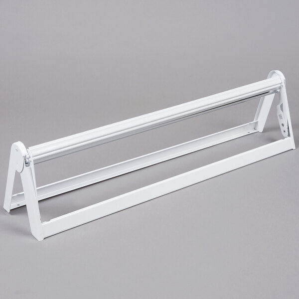 A white metal Bulman paper dispenser with a serrated blade.