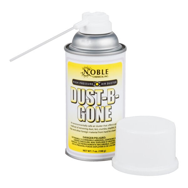 A white cylinder of Noble Chemical Dust-B-Gone air duster on a table.