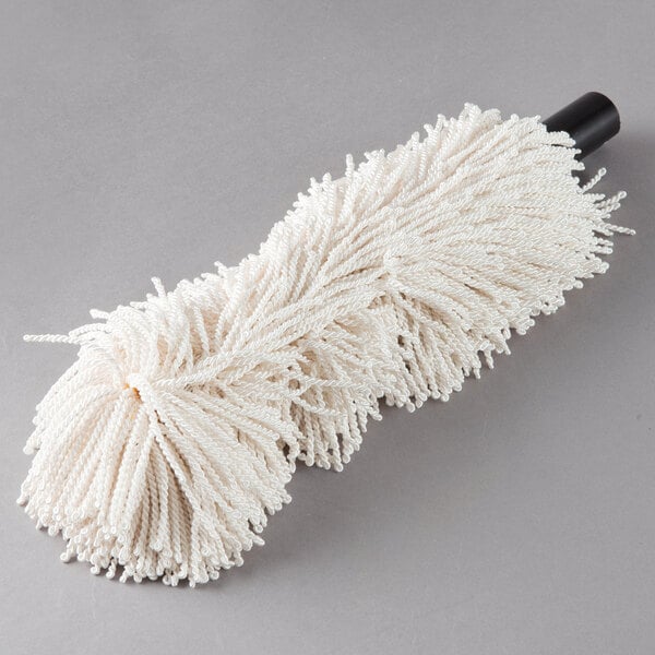 A white mop for a Bar Maid glass washer on a grey surface.