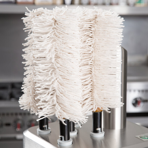 A close-up of the white extra large polishing head set for a Bar Maid glass washer.