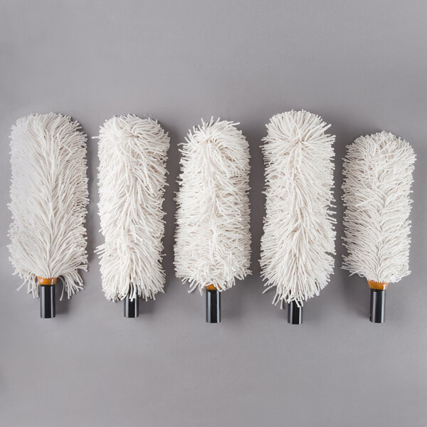 A group of six white Bar Maid polishing heads.