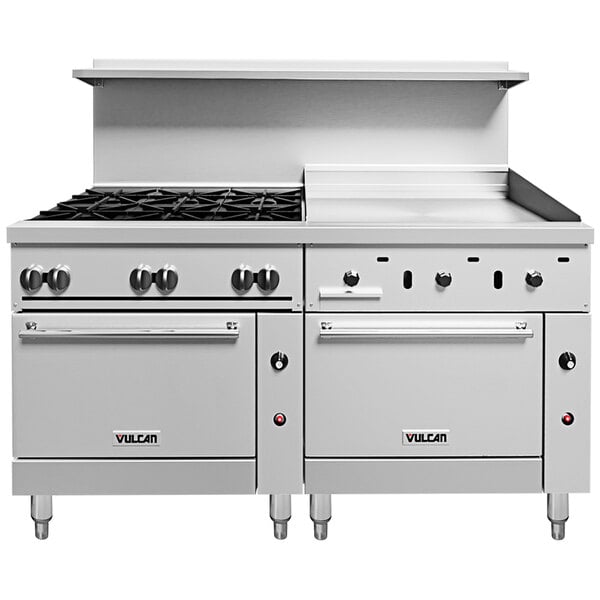 A large stainless steel Vulcan range with black knobs.