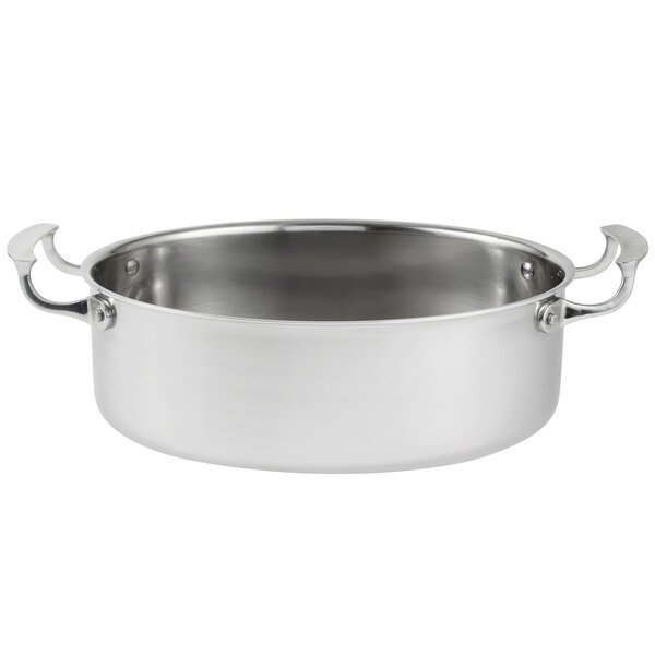 A silver Vollrath Miramar oval au gratin pan with handles.
