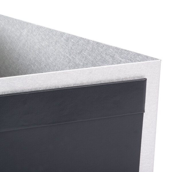 A close-up of a black and silver Menu Solutions Alumitique displayette box with a grey lid.