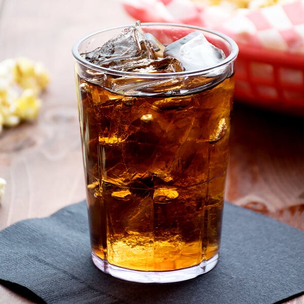 A Cambro clear plastic tumbler filled with ice and brown liquid.