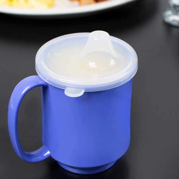 A clear polypropylene lid on a blue cup.