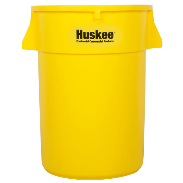 A yellow Continental Huskee trash can with black text and a lid.