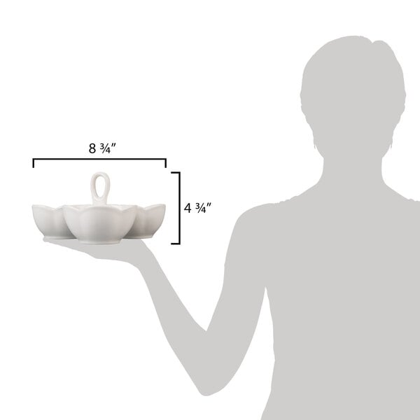 A woman holding a 10 Strawberry Street white porcelain bowl caddy with 3 bowls on it.