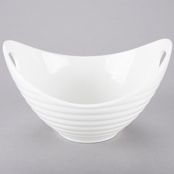 A white bowl with curved lines and handles.