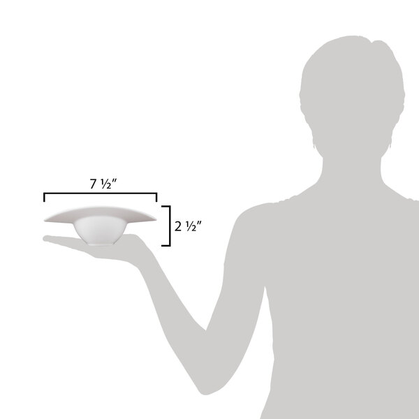 A woman holding a 10 Strawberry Street Somba white porcelain rim bowl.