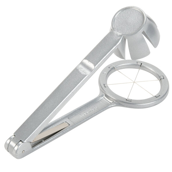 A silver metal Westmark egg wedger with a handle and circular slicer.