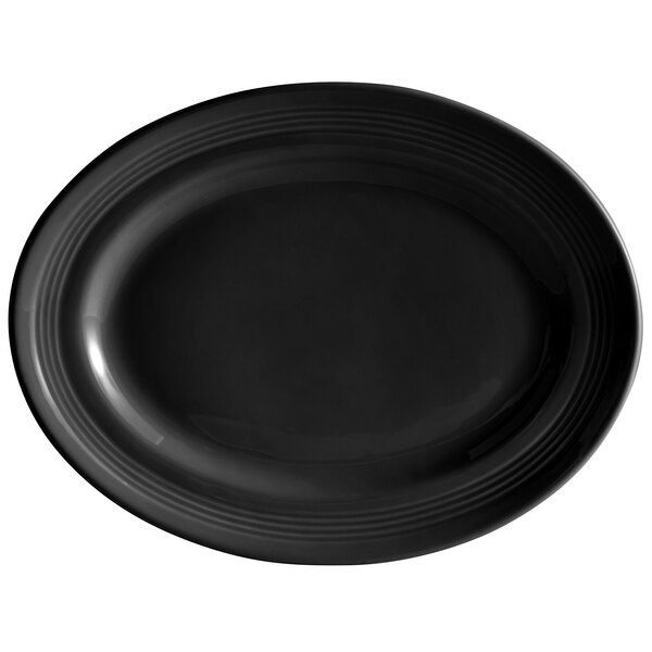 A black oval Tuxton china platter with a rim.