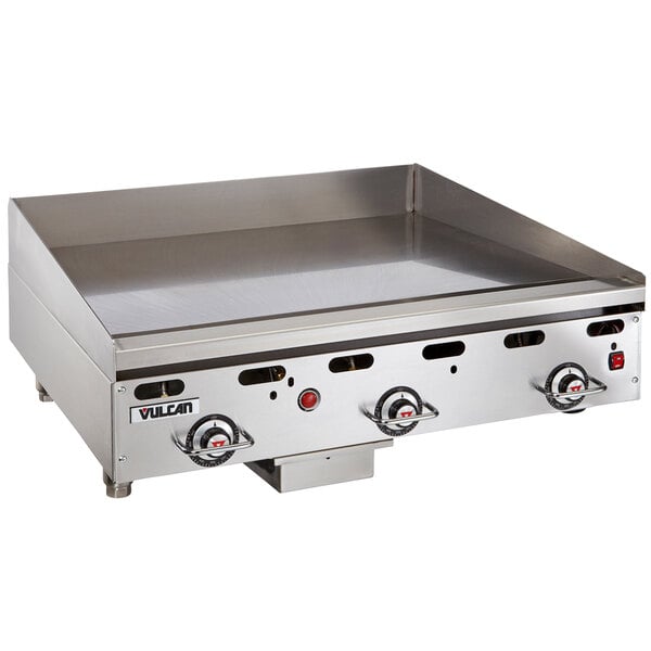 A stainless steel Vulcan 36" gas griddle with thermostatic controls and knobs.