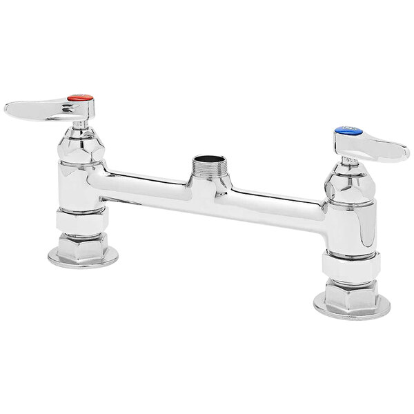 a silver faucet with a red button