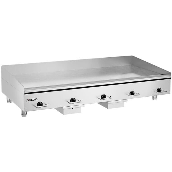 A large stainless steel Vulcan countertop electric griddle with black knobs.