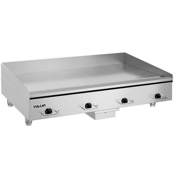 A large stainless steel Vulcan countertop electric griddle with knobs.