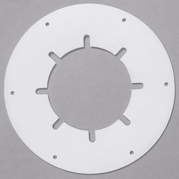 A white circular gasket with holes for cups.
