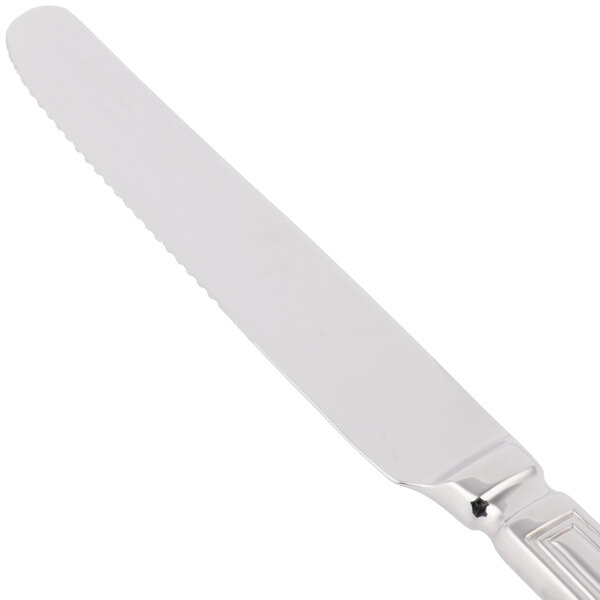 A Libbey stainless steel dinner knife with a handle.