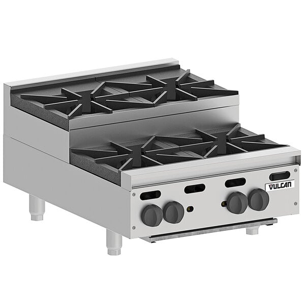 A stainless steel Vulcan countertop range with four burners.