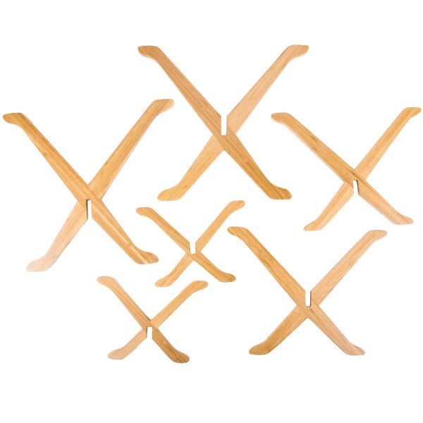 A group of wooden x-shaped Tablecraft bamboo risers.