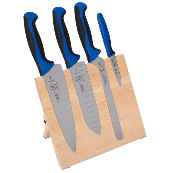 A Mercer Culinary Millennia Colors 5-piece knife set with blue handles on a wooden stand.