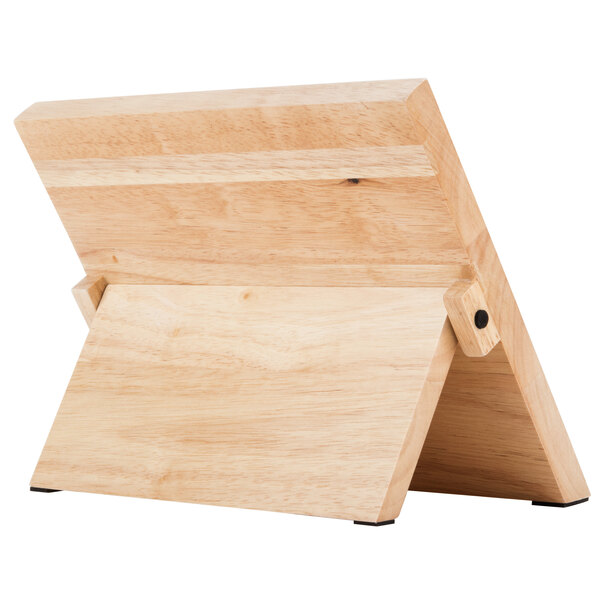 A Mercer Culinary Millennia® rubberwood magnetic board and knife set on a wooden stand.