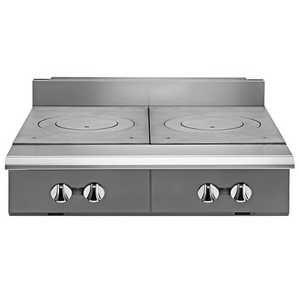 A close-up of a Vulcan V2FT36-LP heavy-duty range with French plates on the stove top.