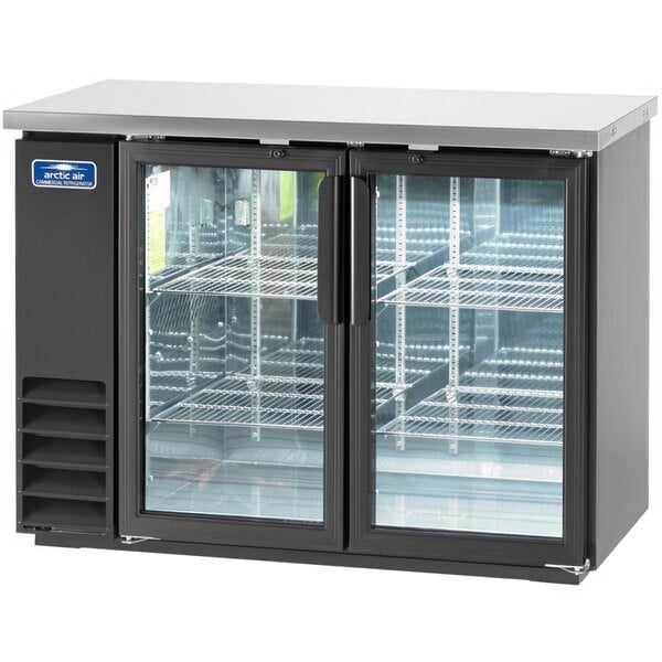 An Arctic Air black refrigerator with glass doors.