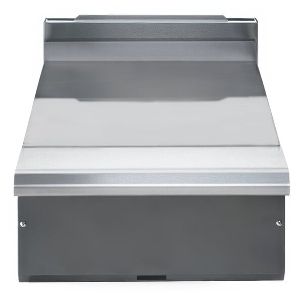 A stainless steel spreader plate with a grey surface and black border.