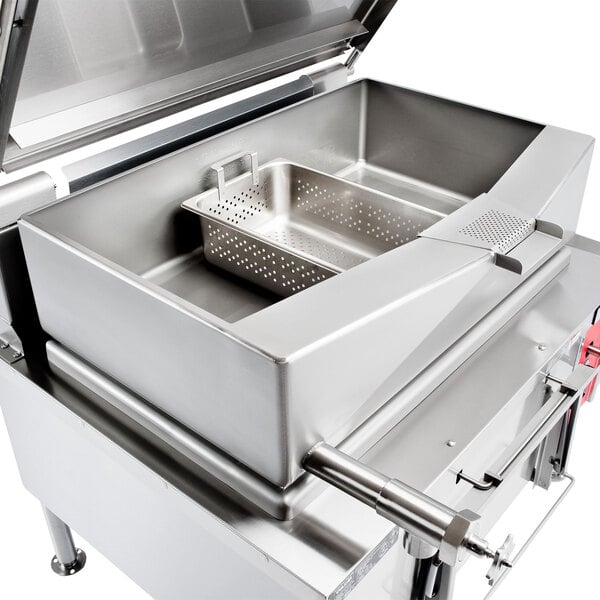 A large stainless steel container with a tilting mechanism inside.