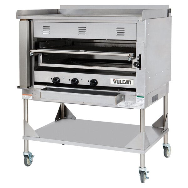 A stainless steel Vulcan Chophouse ceramic broiler with stand and wheels.