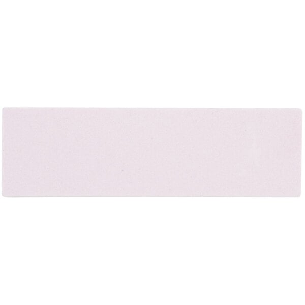 A rectangular white honing stone.