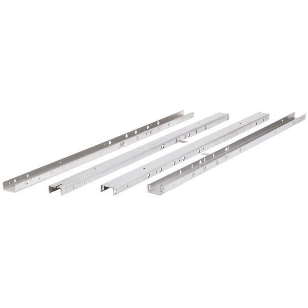 A group of four Vulcan stainless steel brackets.