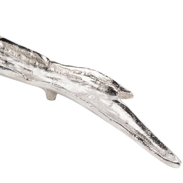 A nickel branch-shaped tray with a long, thin branch.