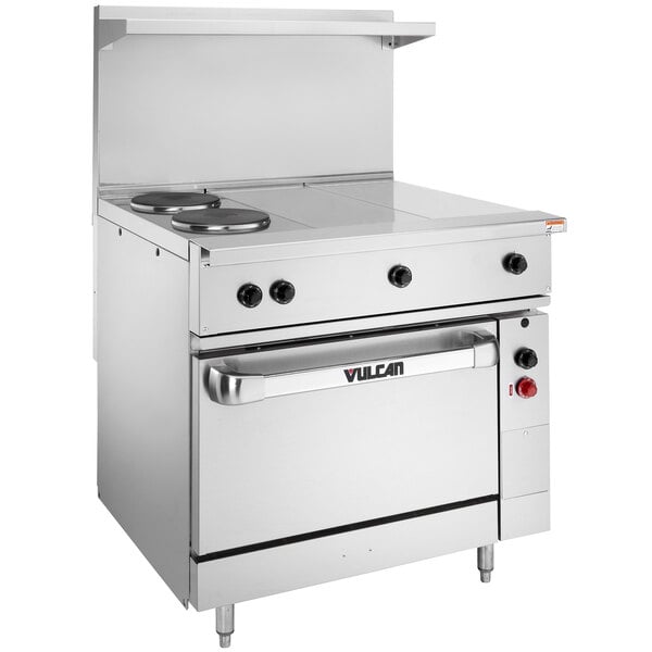 A large stainless steel Vulcan commercial electric range with 2 French plates, 2 hot tops, and 1 standard oven.