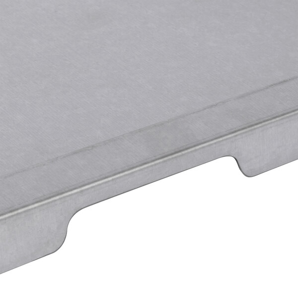 A silver metal crumb tray with a metal handle.