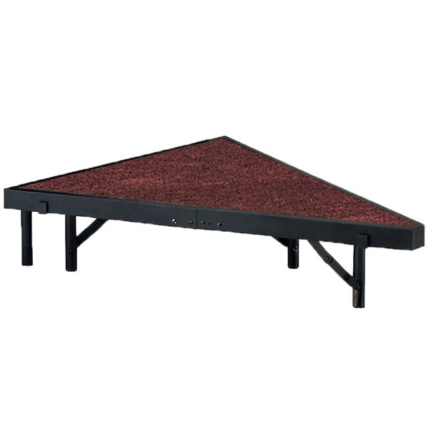 A triangular platform with a red surface.