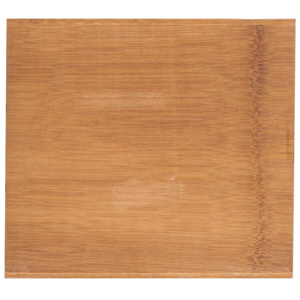An American Metalcraft carbonized bamboo serving board with a wood surface.