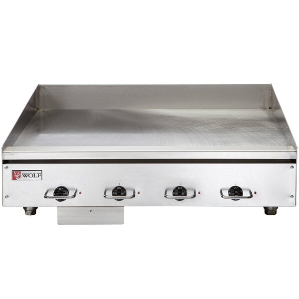 A close-up of a Wolf 48" electric countertop griddle.