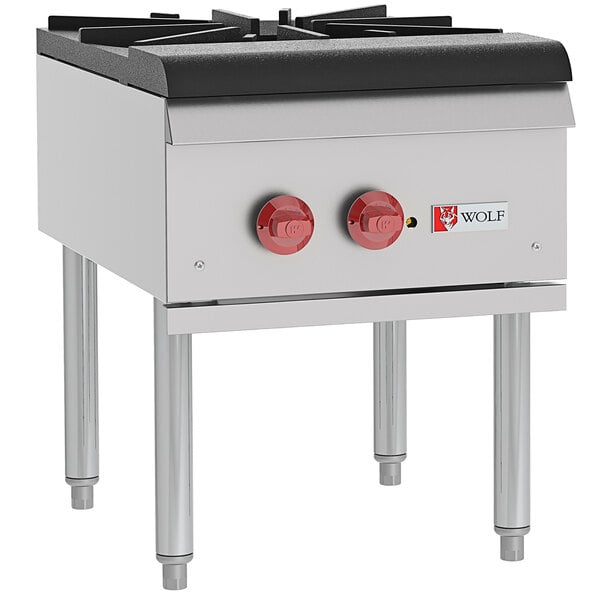 A Wolf by Vulcan natural gas stock pot range with two red knobs.