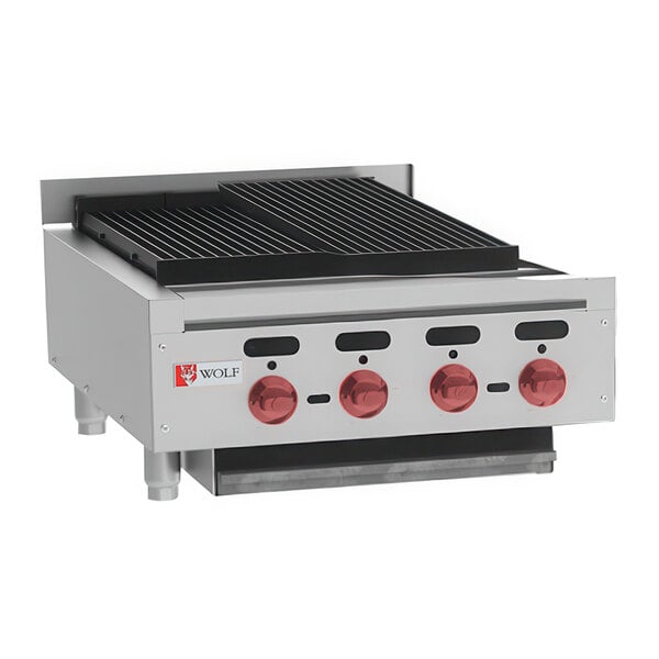 A Wolf by Vulcan stainless steel countertop charbroiler with red knobs.
