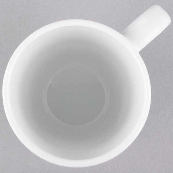 A 10 Strawberry Street white porcelain barrel mug with a handle.