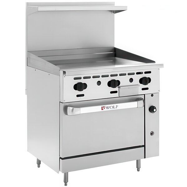 A stainless steel Wolf Challenger XL series natural gas range with griddle and oven.