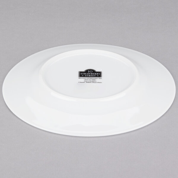 A white 10 Strawberry Street porcelain plate with a black logo.