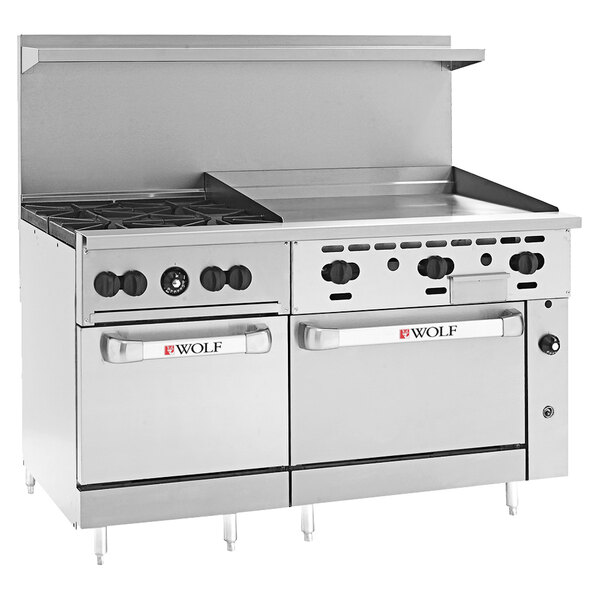 A stainless steel Wolf commercial range with 4 burners, a griddle, and 2 ovens.