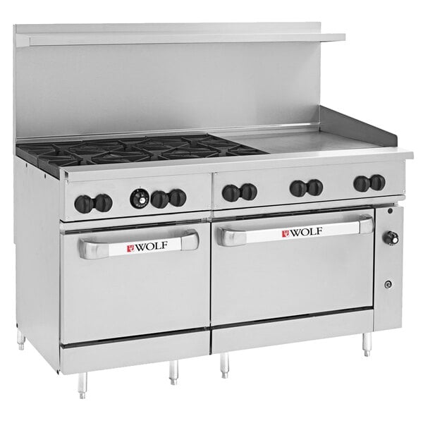 A stainless steel Wolf commercial range with 6 burners, a griddle, and 2 ovens.