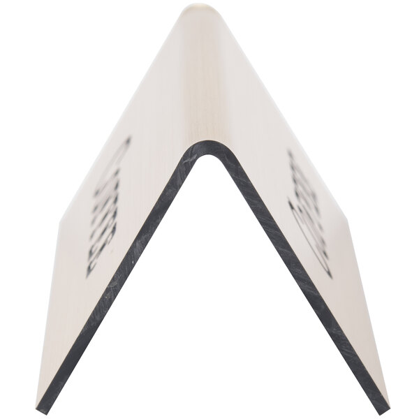 A gold triangular wood sign with a black design.